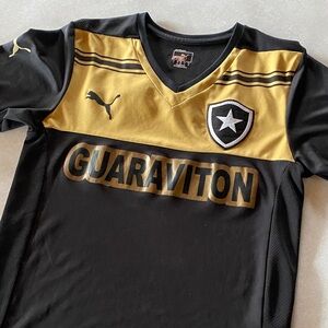 Puma Kids Black and Gold Guaraviton Soccer Jersey. Good condition, size small